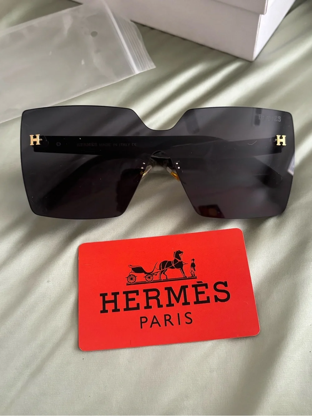 Hermès Women’s Oversized Shield Sunglasses in Black with Gold H Details